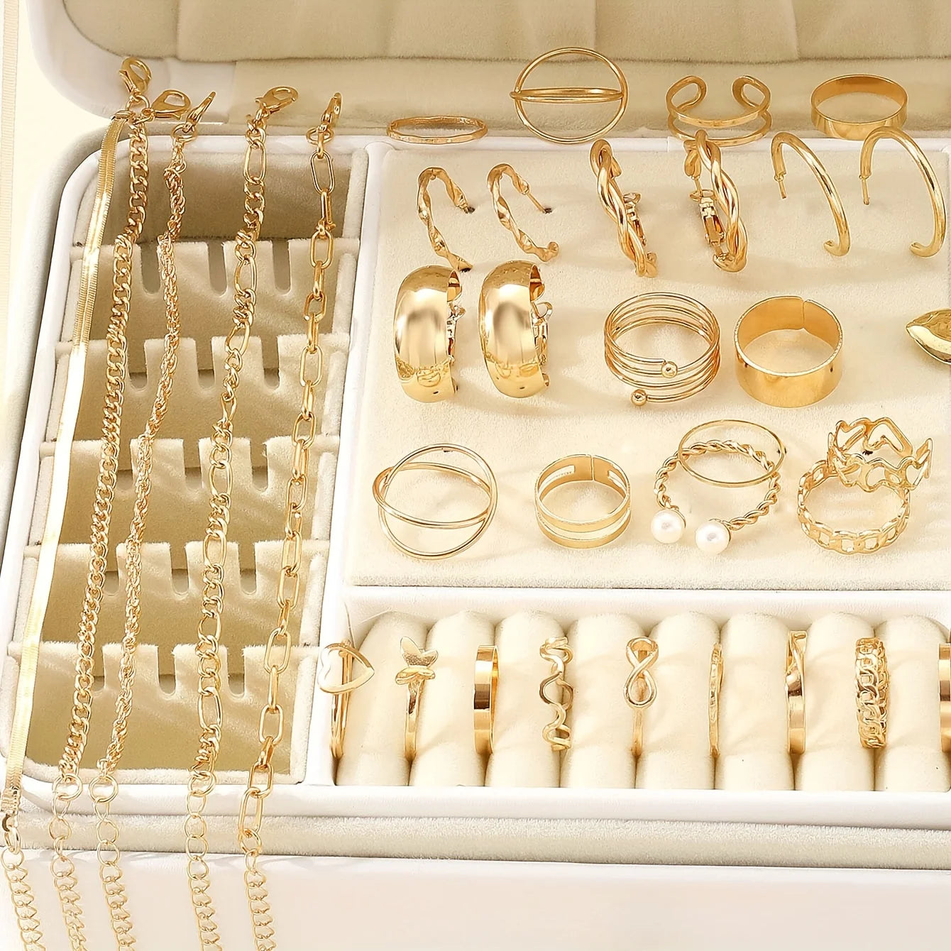 Alt Tag: 54 piece fashion jewelry set with gold-tone rings, hoop earrings, and chain necklaces displayed in a white organizer tray
