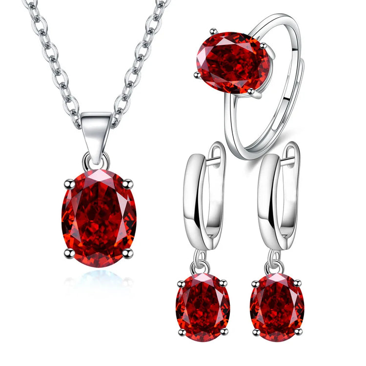 Alt Tag: 925 sterling silver bridal jewelry set with red gemstone pendant necklace, ring, and drop earrings for wedding