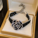 Alt Tag: crystal flower rhinestone choker necklace set with black crystal beads and rhinestone flower pendant in gift box
