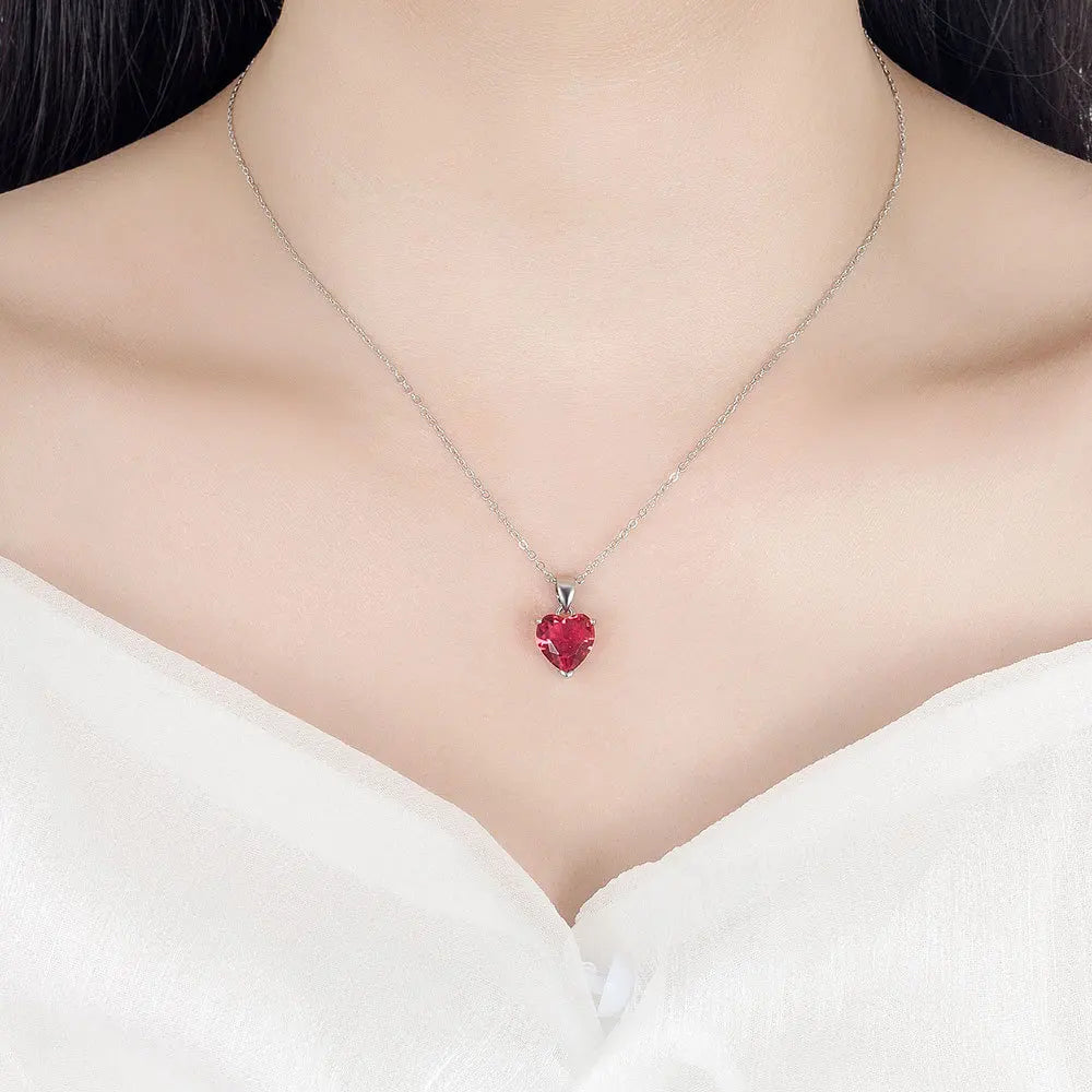 Alt Tag: heart zircon 925 silver bridal jewelry set red heart zircon pendant necklace on bride neckline, elegant wedding jewelry