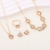 Alt Tag: heart crystal jewelry set for women gold necklace bracelet ring and stud earrings with clear heart crystals
