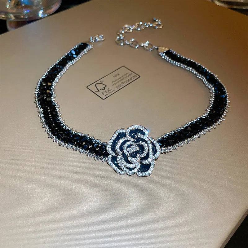 Alt Tag: crystal flower rhinestone choker necklace set with black rhinestone band and sparkling crystal flower centerpiece