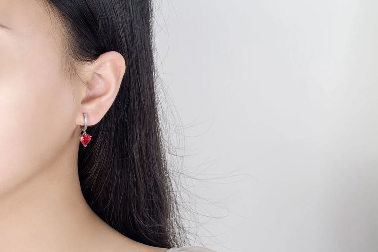 Alt Tag: heart zircon 925 silver bridal jewelry set red heart zircon drop earrings on model ear, sterling silver wedding jewelry