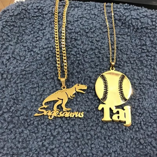 Custom cartoon character name necklace featuring a dinosaur pendant and baseball pendant with personalized names.