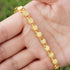 gold Islamic necklace 70cm displayed on a hand, showcasing its shiny geometric design and elegant style.